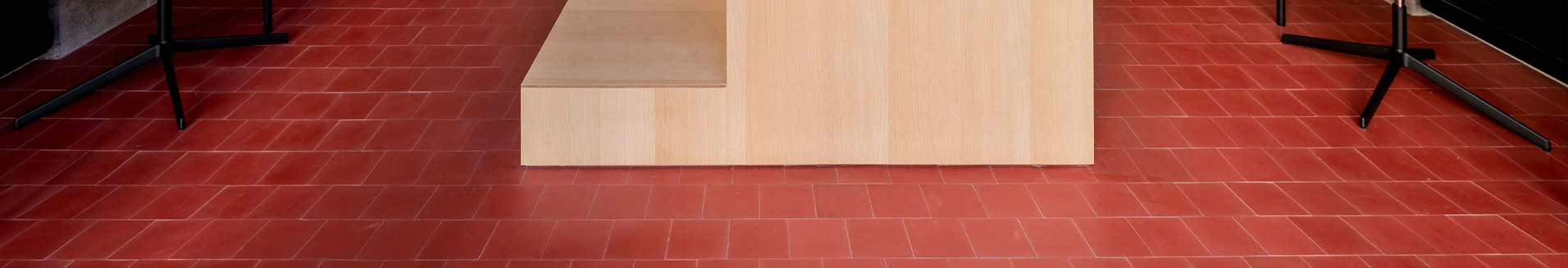2-red hydraulic cement floor of a cement office